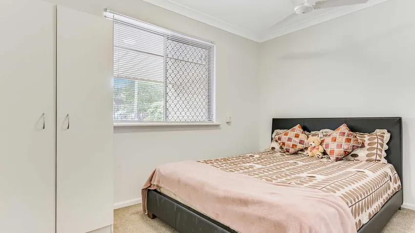 Bright Bedroom with Yard View - After