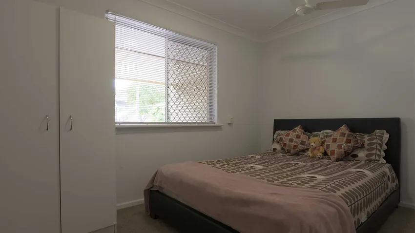 Bright Bedroom with Yard View - Before